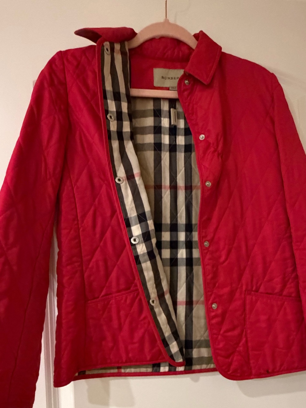 Burberry Hot Pink Quilted Jacket with Plaid Lining.